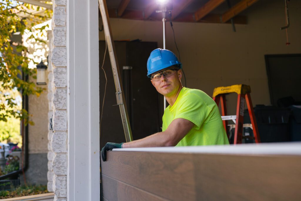 Garage door panel being installed