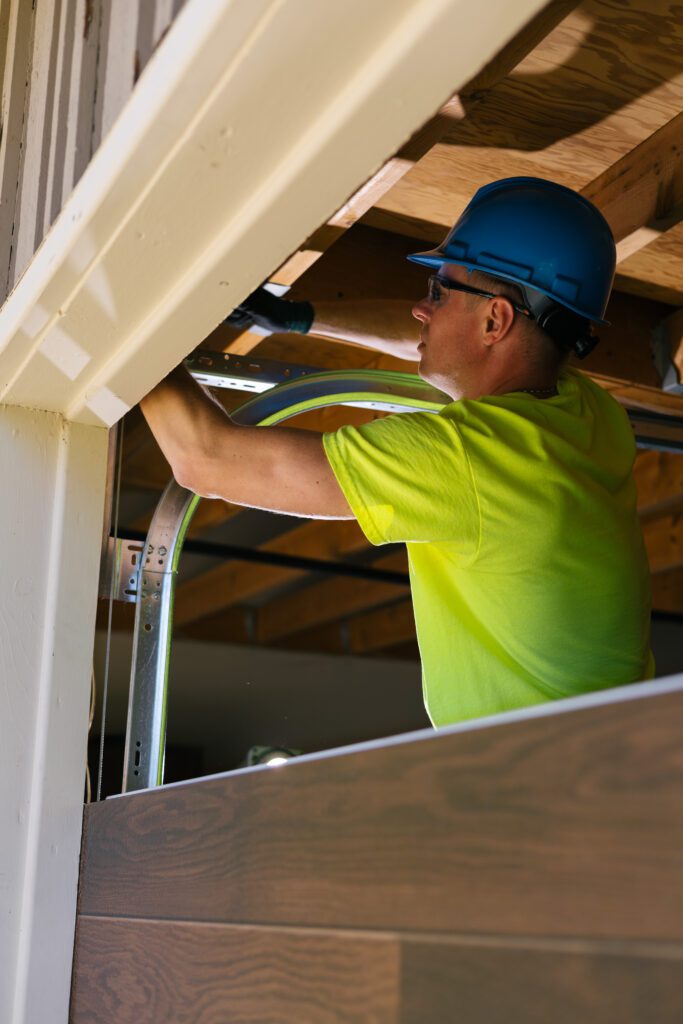 installer with garage door track